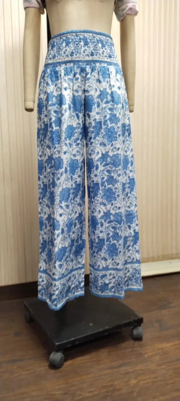 Front view of a blue and white block-print wide-leg trousers on a dress form