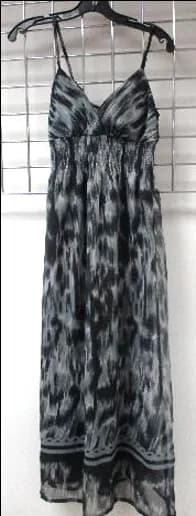 Front view of a grey and black ikat-print strappy maxi dress on a hanger