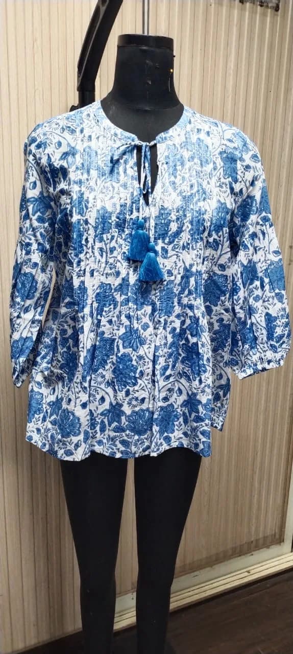 Front view of an indigo and white indigo floral block-print peasant blouse on a dress form