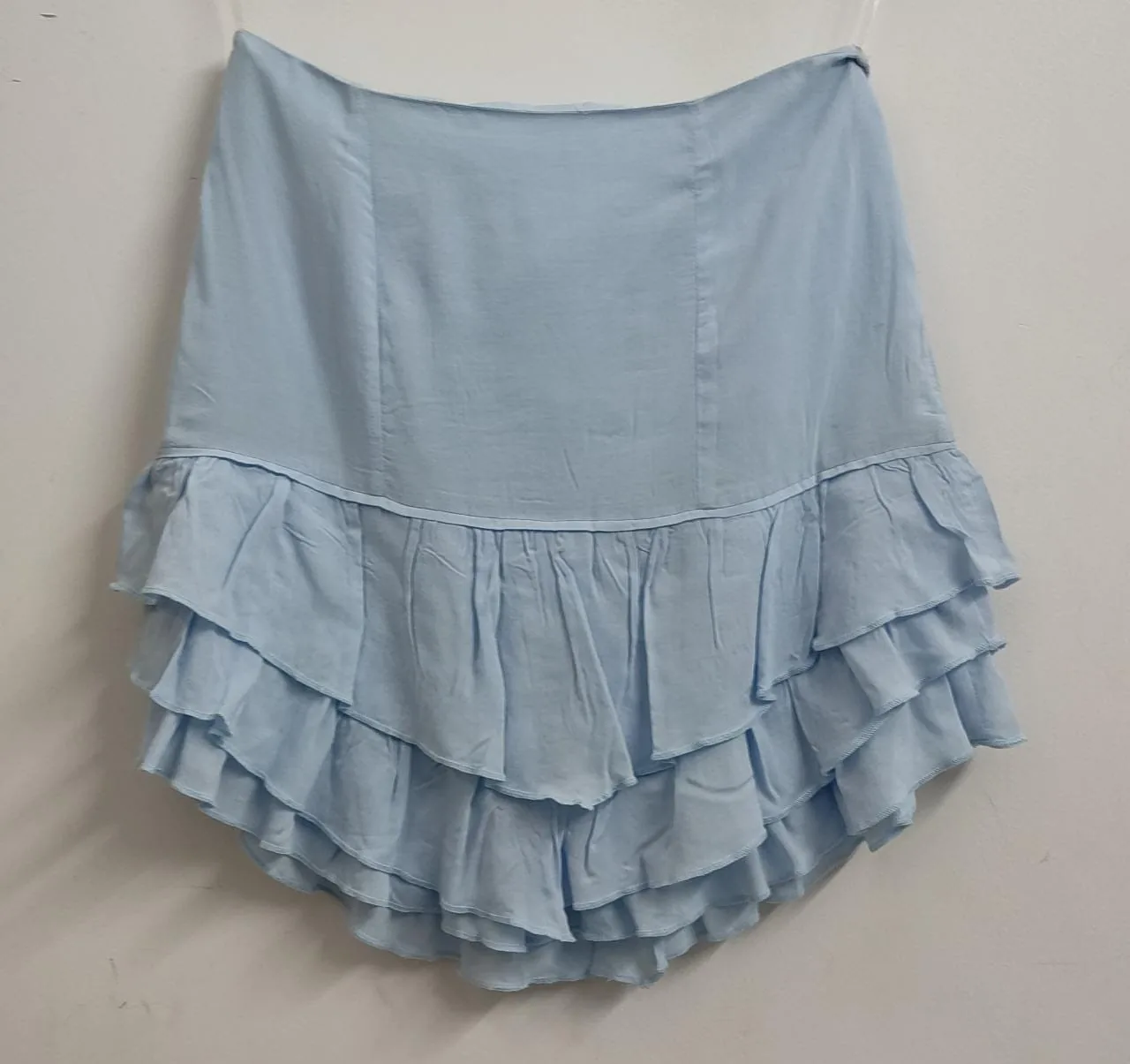Light blue layered ruffle mini skirt laid flat