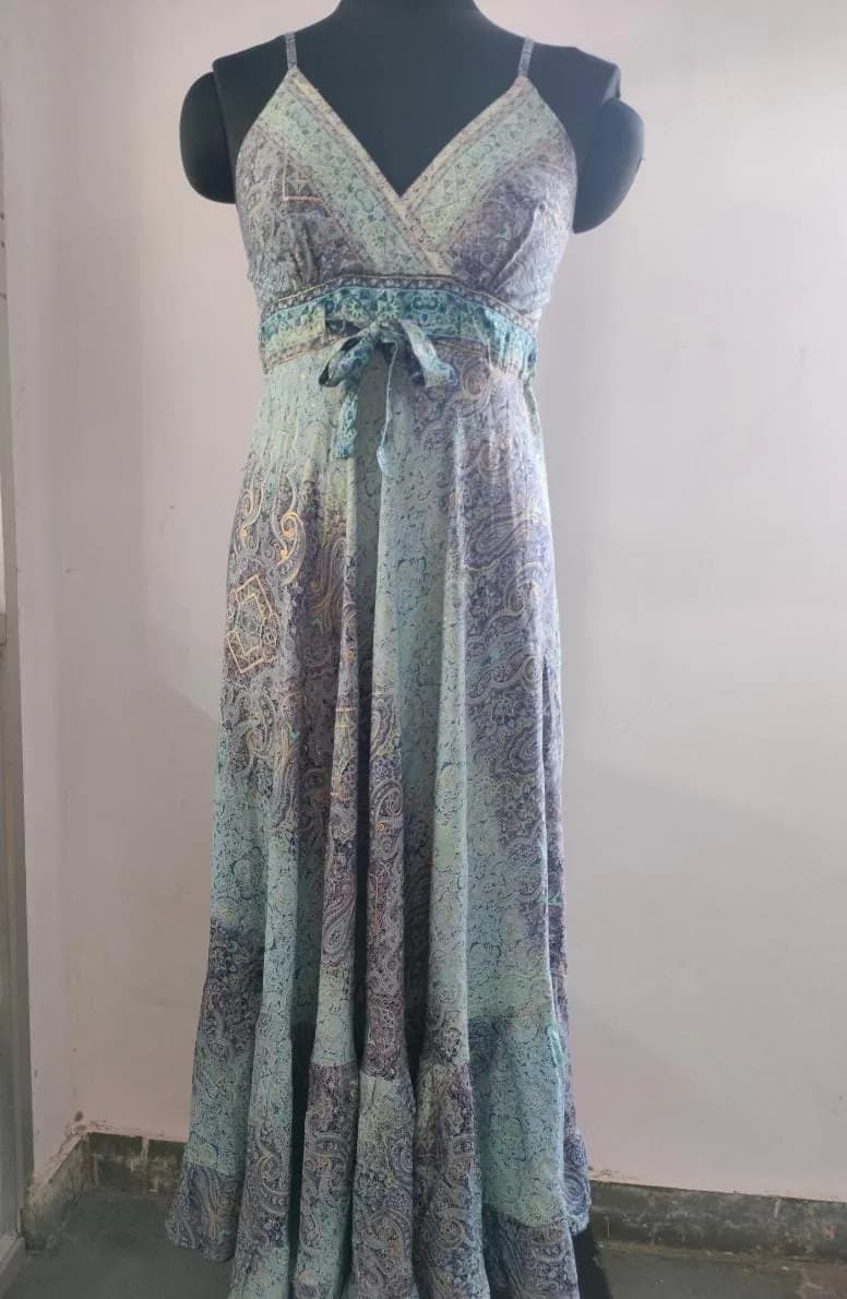 Front view of a blue and mint paisley wrap-bodice maxi dress with tie belt on a dress form