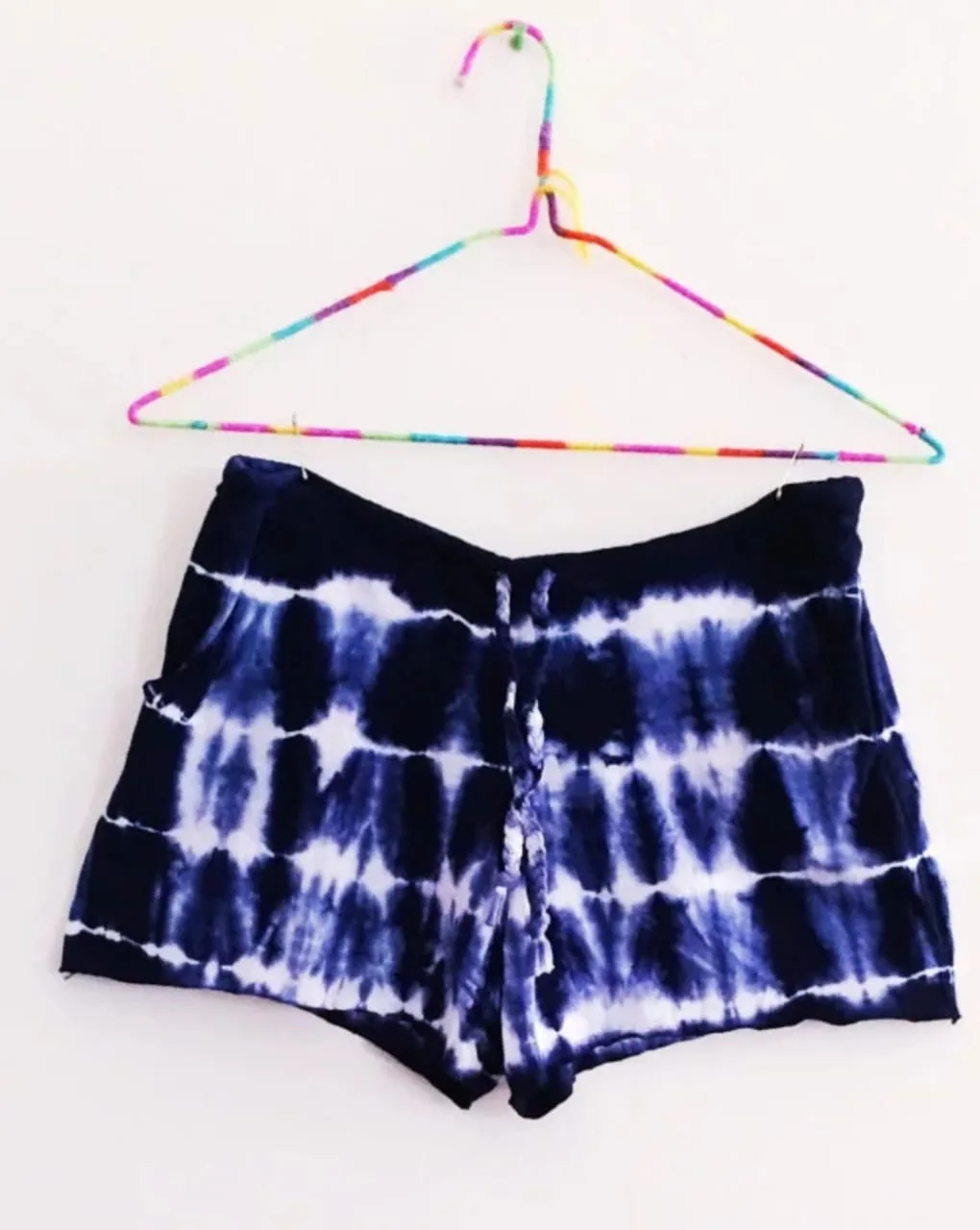 Indigo tie-dye pull-on shorts laid flat