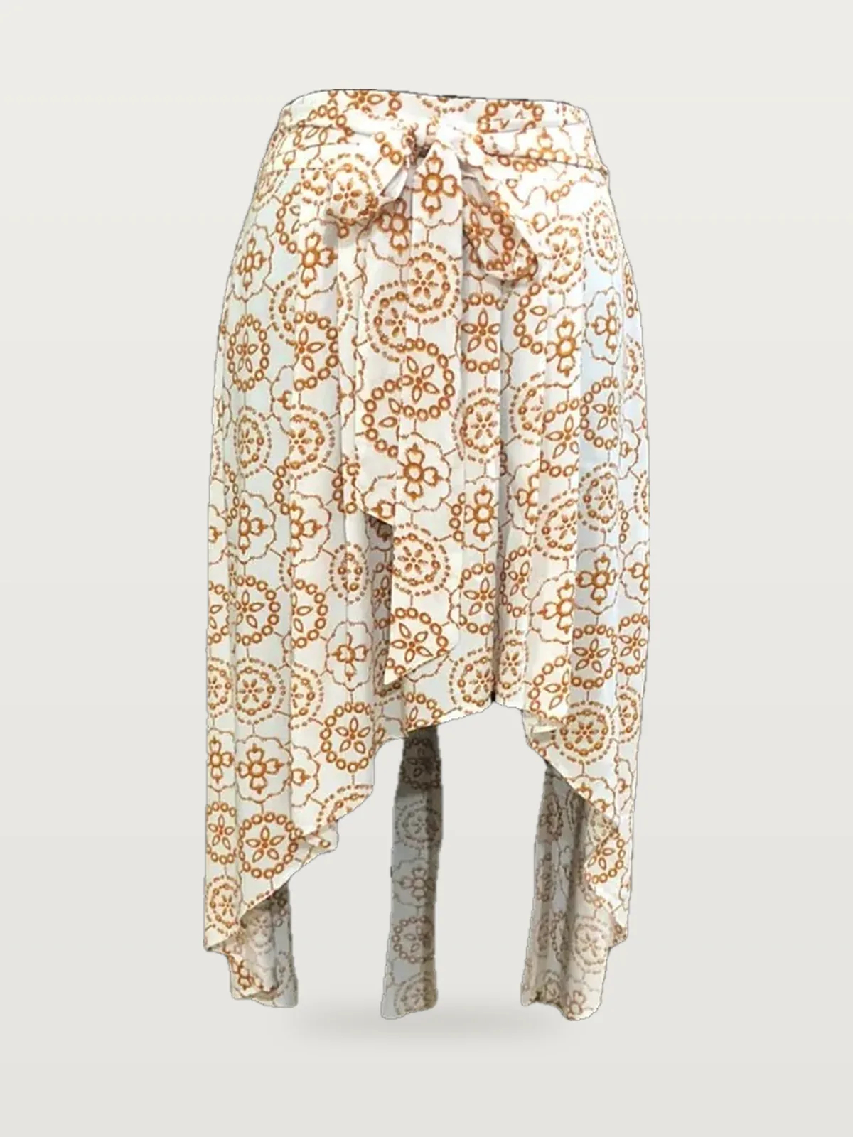 Front view of an orange and white block-print high-low wrap skirt on a dress form