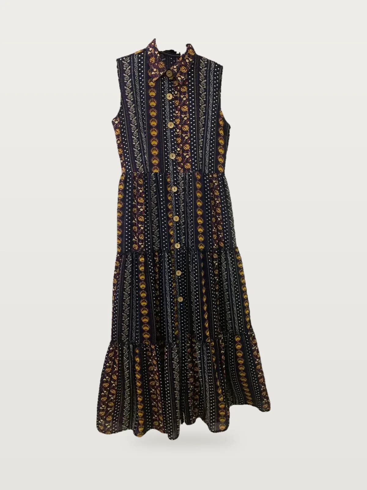Front view of a navy multicolour ethnic-print button-through tiered maxi dress on a hanger