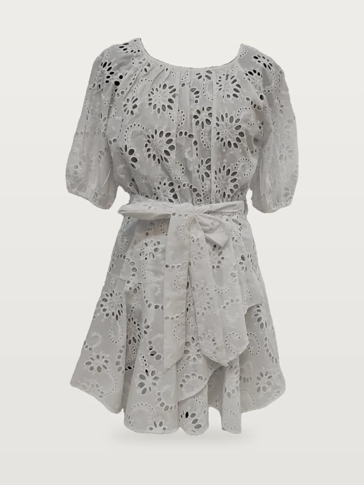 Front view of a white eyelet belted puff-sleeve mini dress on a dress form