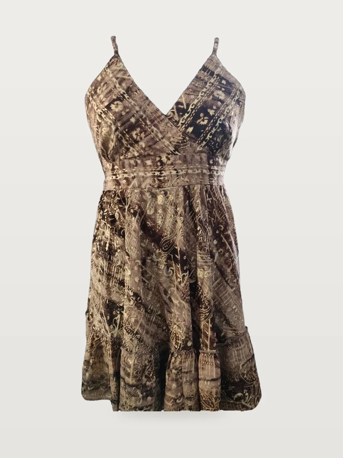 Front view of a brown and gold foil-print wrap-bodice mini sundress on a dress form