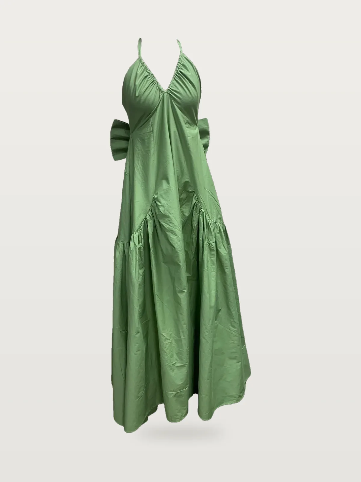 Front view of a sage green halter maxi dress with back bow on a dress form