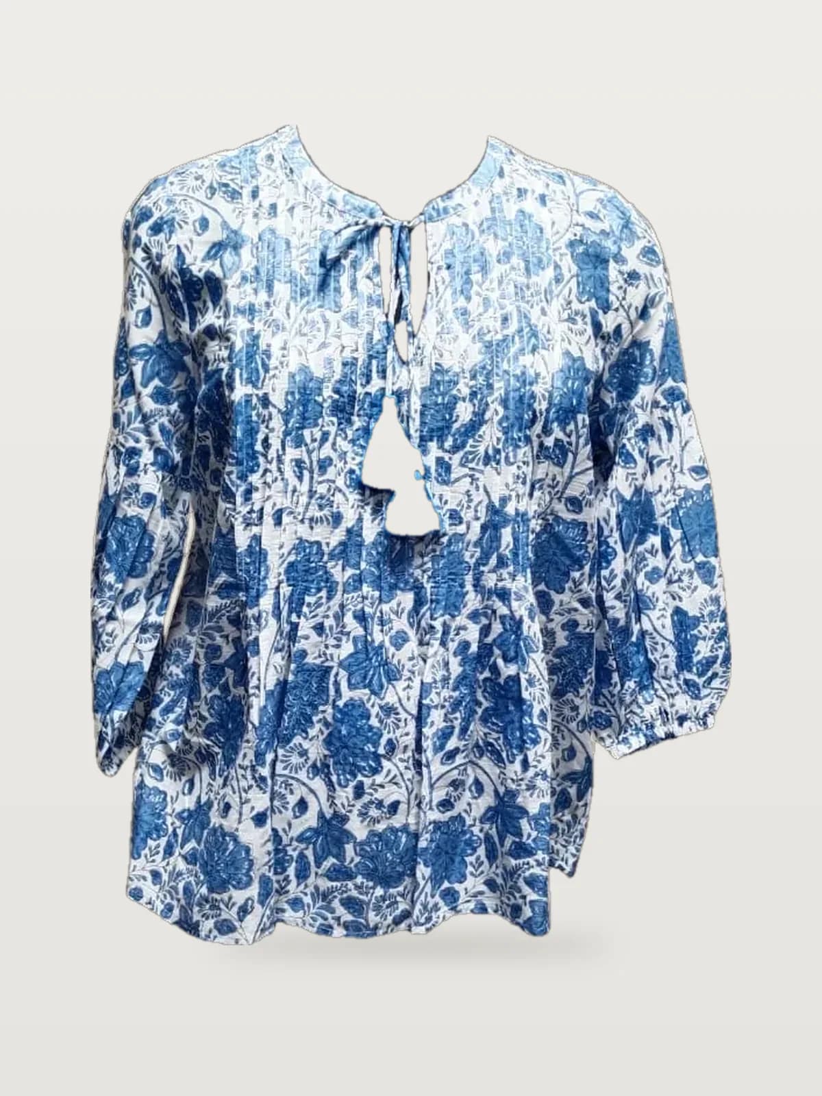 Front view of an indigo and white indigo floral block-print peasant blouse on a dress form