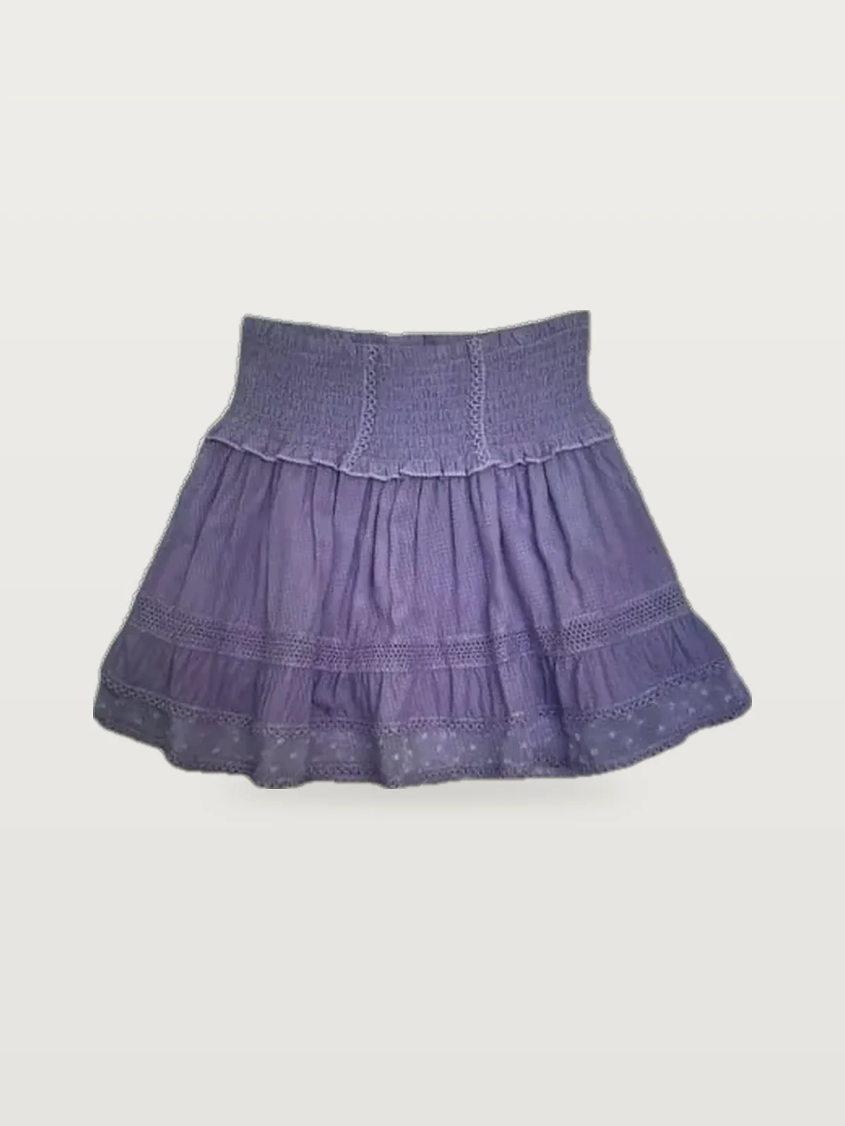 Lilac lace-trim smocked-waist mini skirt laid flat