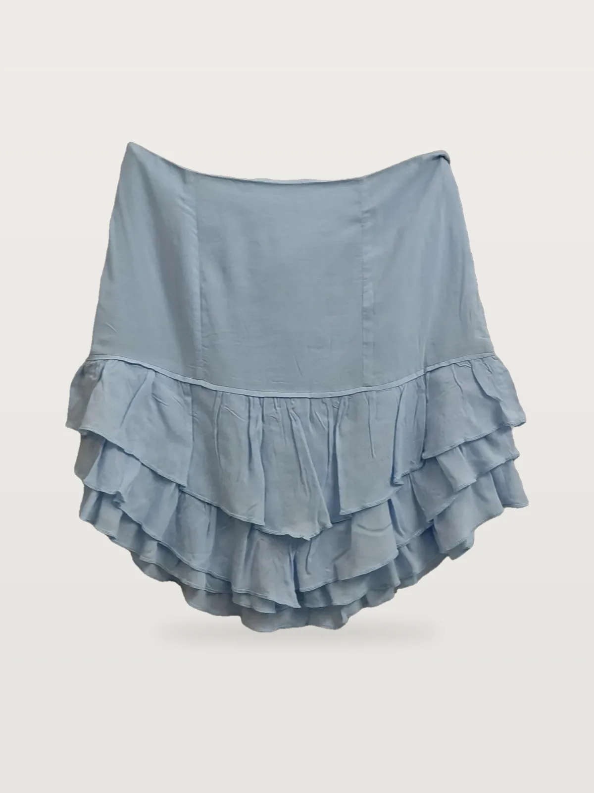 Light blue layered ruffle mini skirt laid flat