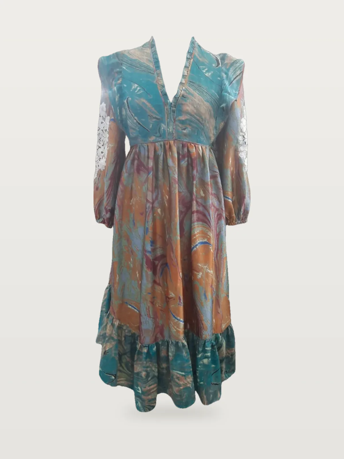 Front view of a teal and orange marble-print maxi dress with lace sleeves on a dress form
