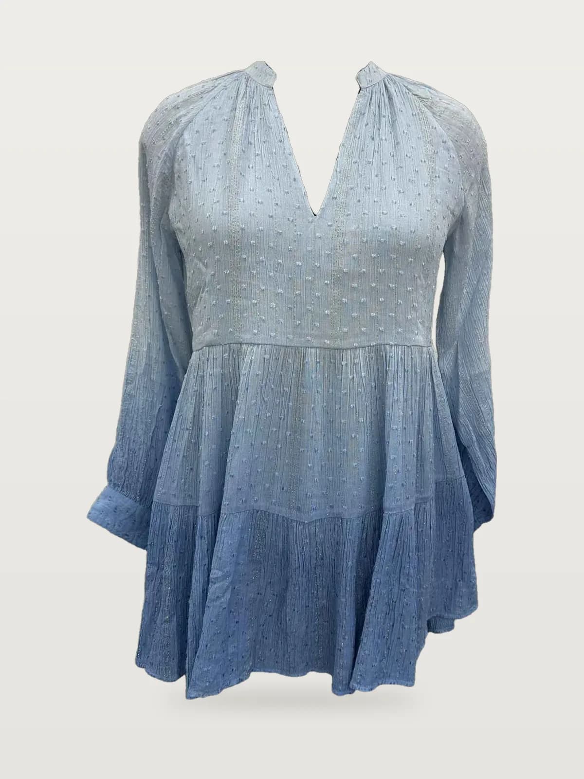 Front view of a blue ombré ombré dip-dye long-sleeve tiered mini dress on a dress form