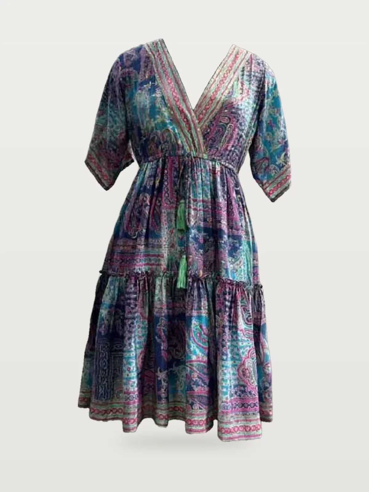 Front view of a blue, pink and green paisley foil-print kaftan dress with tie waist on a dress form