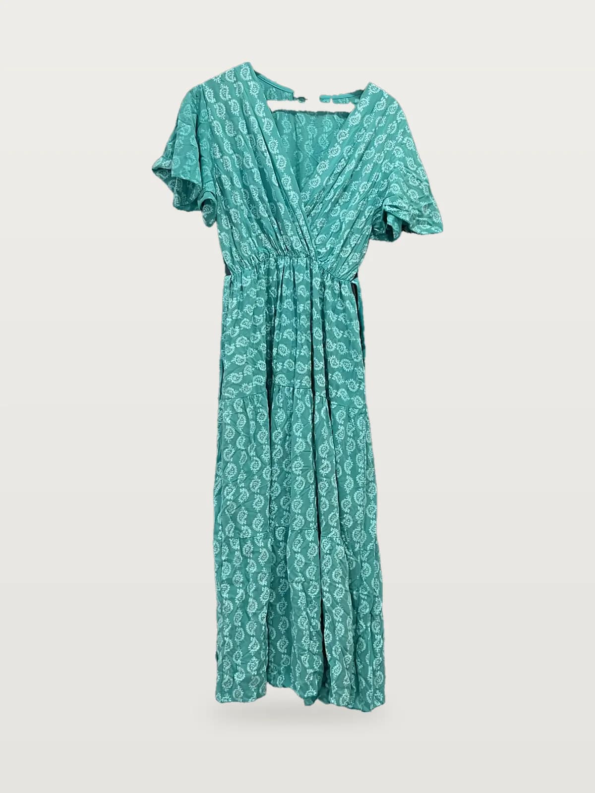 Front view of a teal printed wrap flutter-sleeve maxi dress on a hanger