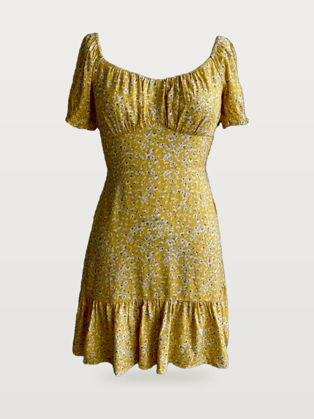 Front view of a yellow floral puff-sleeve ditsy floral mini dress on a dress form