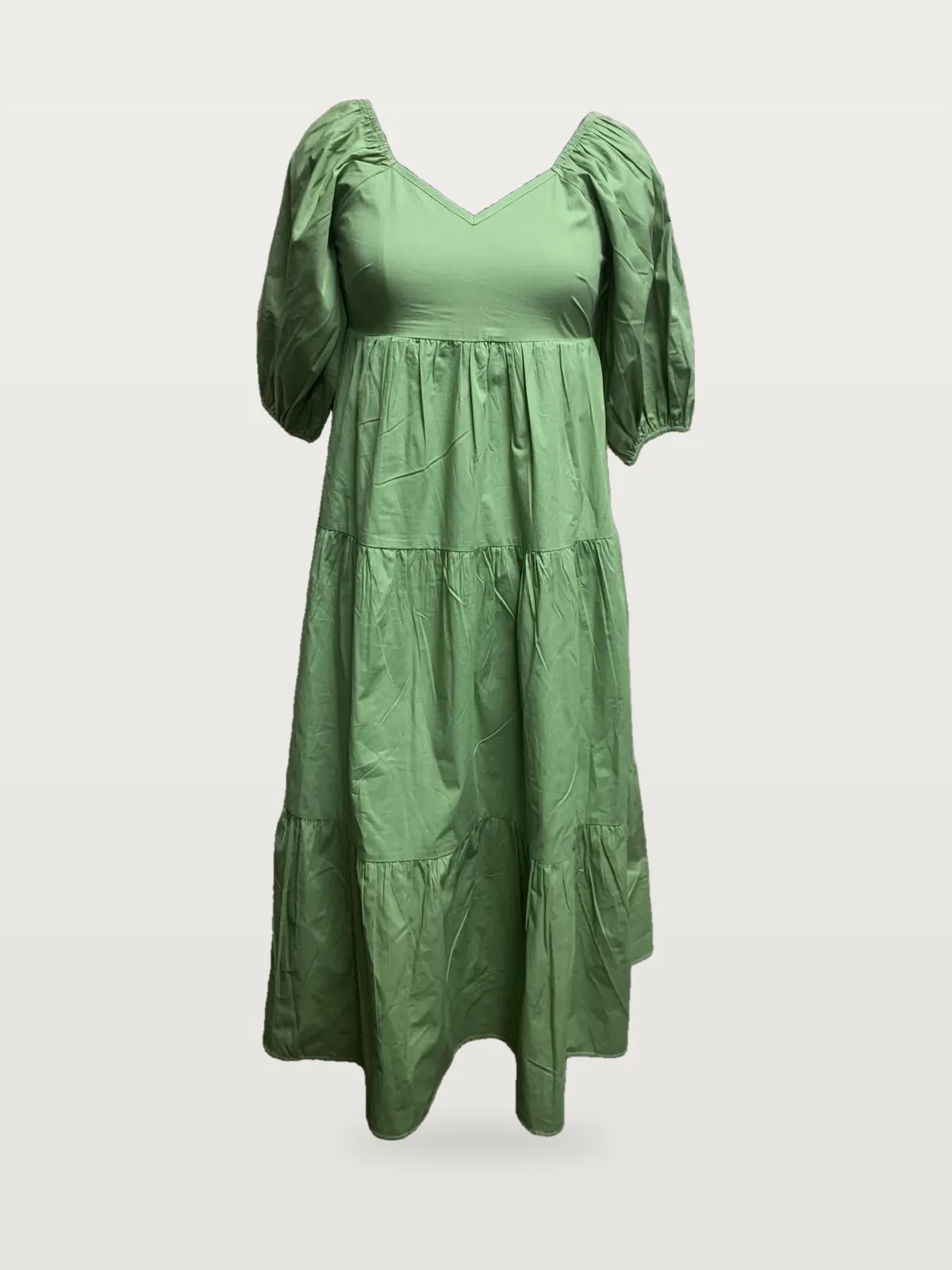 Front view of a sage green puff-sleeve sweetheart tiered maxi dress on a dress form