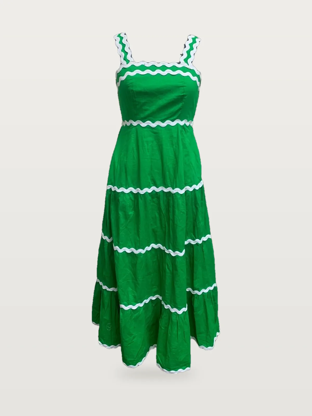 Front view of a green ric-rac trim tiered maxi dress on a dress form
