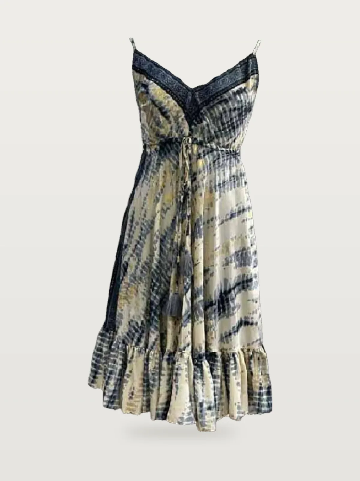 Front view of an indigo and cream shibori strappy mini dress with block-print border on a dress form