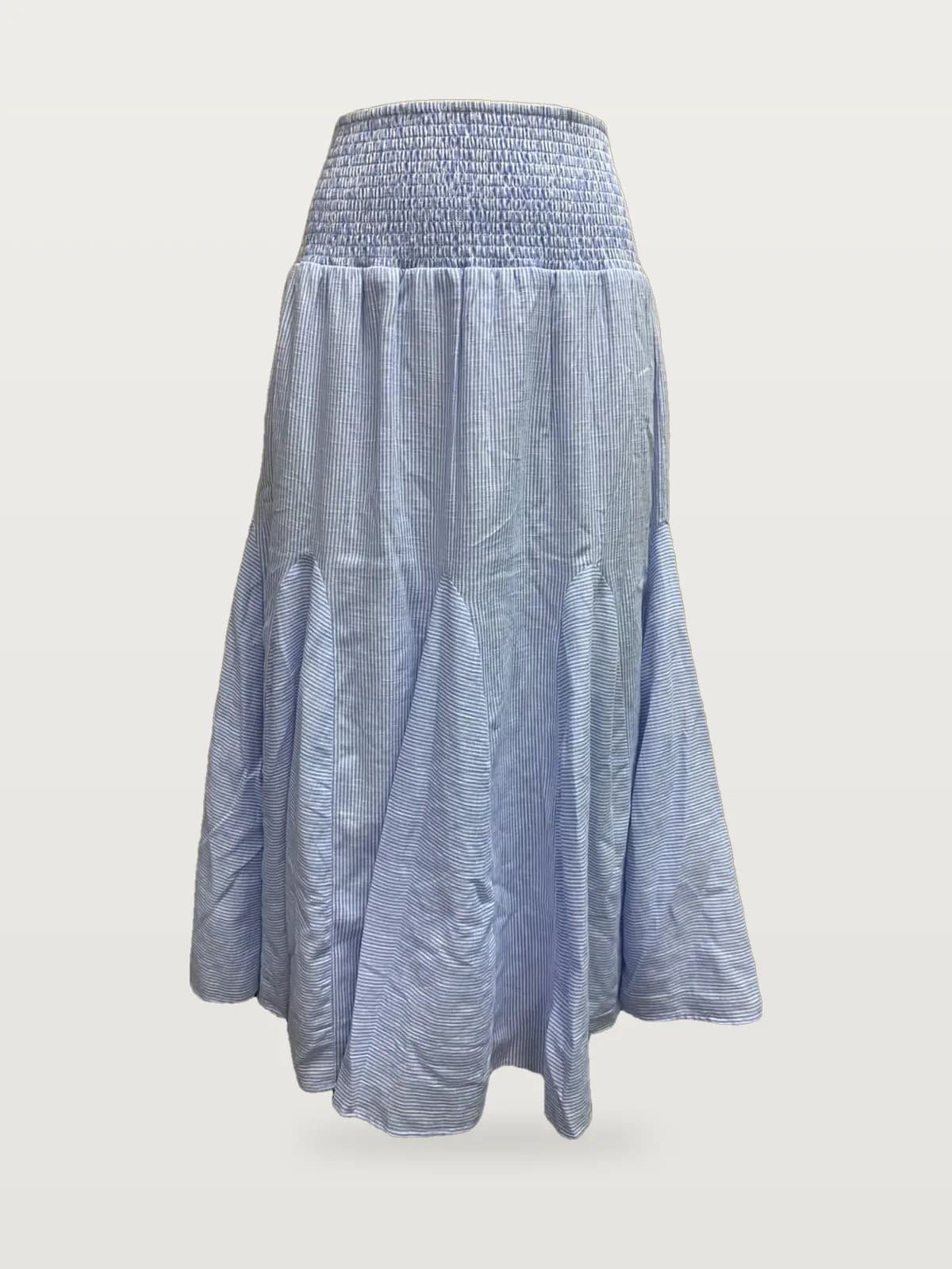 Front view of a light blue smocked-yoke godet maxi skirt on a dress form